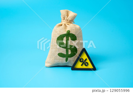The dollar is a money bag with interest. High interest rate on the loan. Loan servicing pressure. Mortgage burden. Inflation control policy. Financial caution. Capital cost increase. 129055996