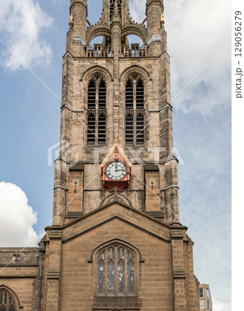 Hands and face of a Cathedral clock exterior on Newcastle Cathedral. 129056279