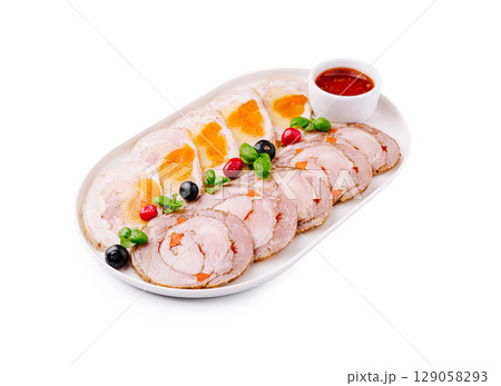 Gourmet meat platter with garnishes for a refined dining experience 129058293