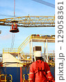 Crews boat moving the passenger and cargo from the platform to supply boat in oil and gas industry. Support offshore oil and gas industry by boat and service team. 129058361