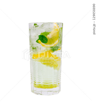 Refreshing mint and lemon drink served in a tall glass with ice Refreshing mint and lemon drink served in a tall glass with ice 129058890
