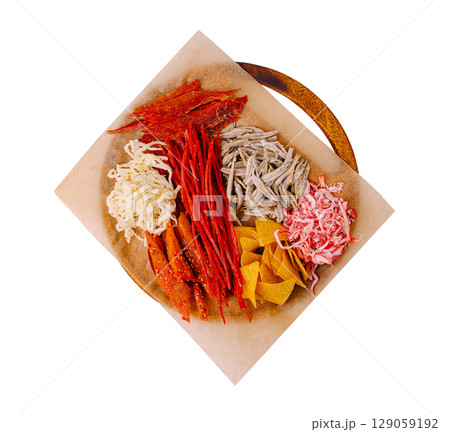 Colorful assortment of traditional snacks served on a wooden platter 129059192