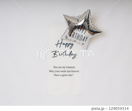 Elegant birthday card with silver star balloon and heartfelt message on white background, perfect for celebration-themed visuals Elegant birthday card with silver star balloon and heartfelt message on white background, perfect for celebration-themed visuals 129059314