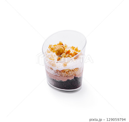 Delicious layered dessert featuring cream, chocolate, and nuts Delicious layered dessert featuring cream, chocolate, and nuts 129059794
