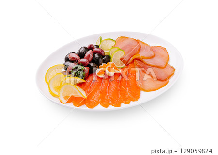 Fresh seafood platter featuring smoked salmon and garnishes Fresh seafood platter featuring smoked salmon and garnishes 129059824