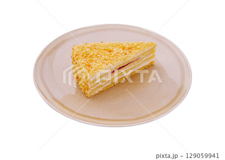 Layered cake slice on a plate with a golden crumb topping Layered cake slice on a plate with a golden crumb topping 129059941