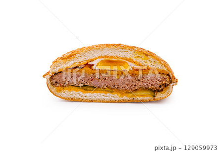 Delicious meat sandwich served with pickles and spicy sauce 129059973