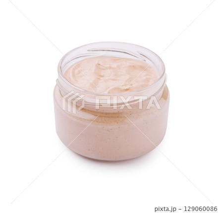 Pink creamy sauce in a transparent jar, smooth and rich, perfect for burgers or sandwiches Pink creamy sauce in a transparent jar, smooth and rich, perfect for burgers or sandwiches 129060086