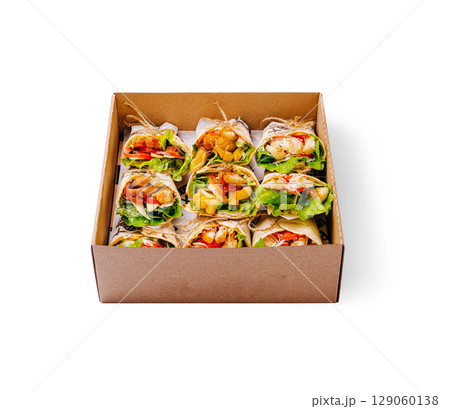 Healthy wraps in a cardboard box displayed on a white surface 129060138
