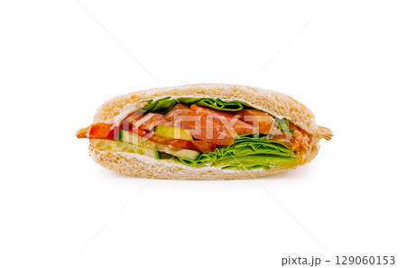 Delicious sandwich with vegetables and salmon on a white background Delicious sandwich with vegetables and salmon on a white background 129060153
