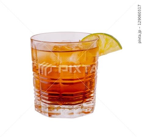 Refreshing drink served in a glass with lime garnish on a clear background 129060317
