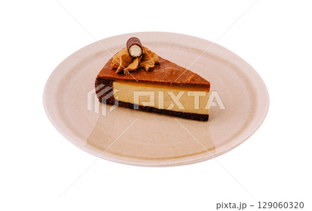 Delicious slice of caramel cheesecake on a simple plate Delicious slice of caramel cheesecake on a simple plate 129060320