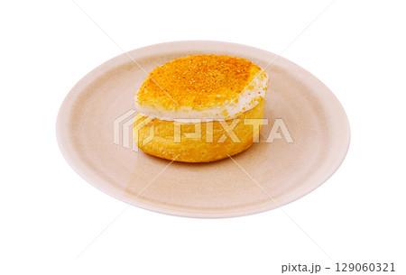 Delicious dessert featuring a fluffy pastry topped with sweet cream Delicious dessert featuring a fluffy pastry topped with sweet cream 129060321