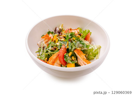 Healthy salad with grilled chicken and mixed greens served in a bowl Healthy salad with grilled chicken and mixed greens served in a bowl 129060369
