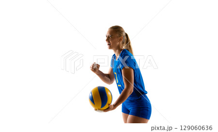 Female volleyball player holding ball and cheering with joy Female volleyball player holding ball and cheering with joy 129060636