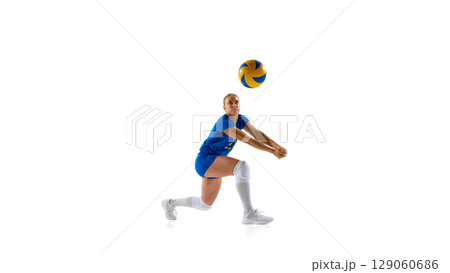 Female volleyball player diving to hit ball on white background Female volleyball player diving to hit ball on white background 129060686