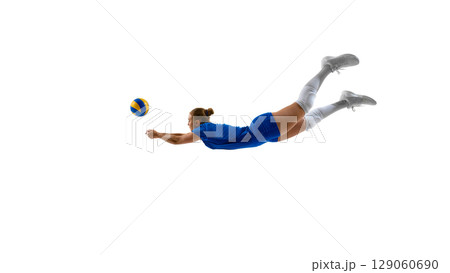 Female volleyball player diving to hit the ball against white background Female volleyball player diving to hit the ball against white background 129060690
