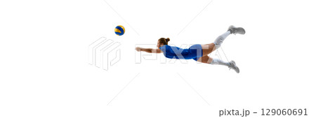 Female athlete diving to hit volleyball in mid-air action on white background. Banner Female athlete diving to hit volleyball in mid-air action on white background. Banner 129060691