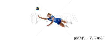 Female volleyball player diving to hit ball on white background. Banner Female volleyball player diving to hit ball on white background. Banner 129060692