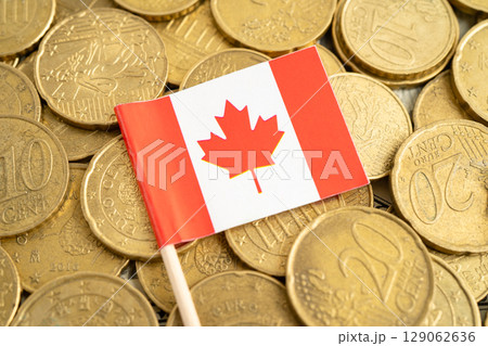 Canada flag on coins background for finance banking business. 129062636