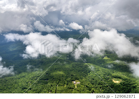 Nature landscape of Tennessee Appalachian mountains. Mountain forest with green canopies in summer rain season Nature landscape of Tennessee Appalachian mountains. Mountain forest with green canopies in summer rain season 129062871