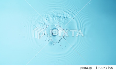 Blue Water drop falling, macro splash. Natural background. 129065190