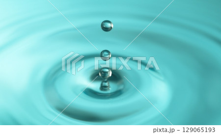 Blue Water drop falling, macro splash. Natural background. Blue Water drop falling, macro splash. Natural background. 129065193