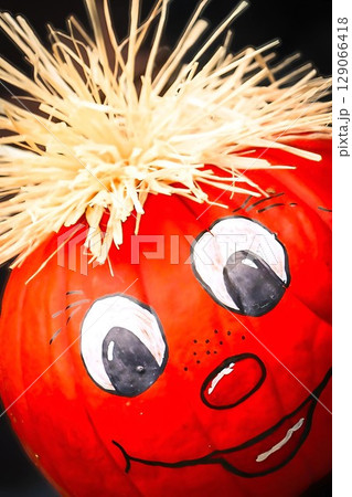 Festive Pumpkin with Straw Hair Festive Pumpkin with Straw Hair 129066418