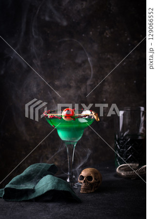Spooky green Halloween cocktail with eyeball Spooky green Halloween cocktail with eyeball 129066552