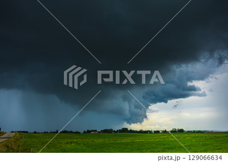 Dark supercell storm clouds with massive rain. Dark supercell storm clouds with massive rain. 129066634