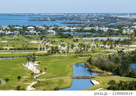 Large golf course and sports grounds with green grass in Boca Grande, small town on Gasparilla Island in southwest Florida 129066814
