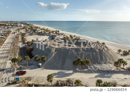 Hurricane Milton aftermath cleanup. Sand piles at Englewood Beach on Manasota Key. Sand recipient site after storm surge 129066854