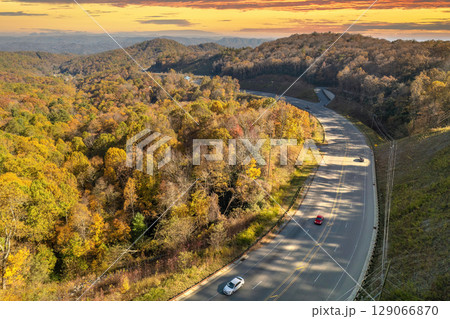 Highway road in USA. American freeway road with fast driving cars. Transportation infrastructure in North Carolina Appalachian mountains Highway road in USA. American freeway road with fast driving cars. Transportation infrastructure in North Carolina Appalachian mountains 129066870