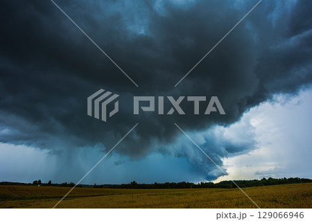 Dark supercell storm clouds with massive rain shaft. Dark supercell storm clouds with massive rain shaft. 129066946