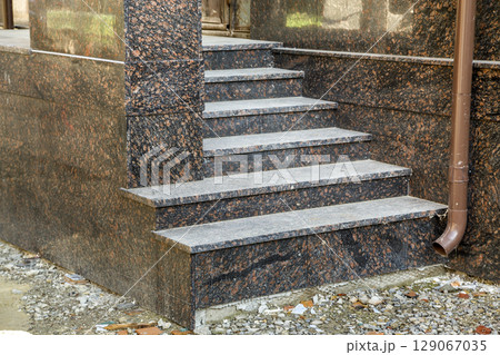 Detail of a house facade. New granite stairs. 129067035