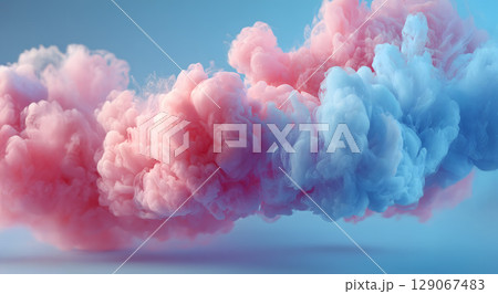 Cotton candy wisps floating in air create dreamy atmosphere with soft pink and blue hues, evoking sense of whimsy and joy 129067483