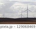 Wind Power Turbines Over Agricultural Farming Landscape 129068469