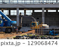 Heavy Machinery Working On Building Construction Site 129068474