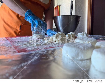 Crafting fresh dough and pastries in a vibrant kitchen setting Crafting fresh dough and pastries in a vibrant kitchen setting 129068764