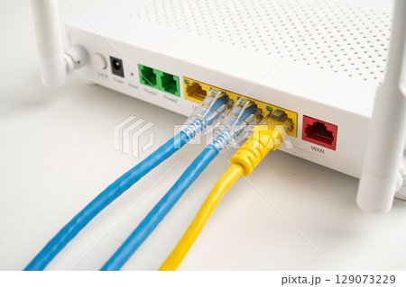 Ethernet cable with wireless router connect to internet service provider internet network. 129073229