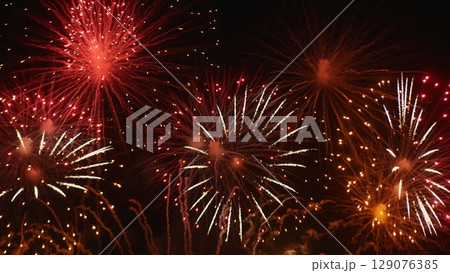 Red Firework celebrate anniversary happy new year 2024, 4th of july holiday festival. red firework in night time celebrate national holiday. Countdown to new year 2025 festival party time event 129076385