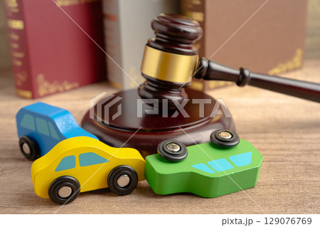 Car accident lawsuit and insurance, Judge hammer with car model. 129076769