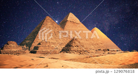 night scene of the castle pyramid in the desert 129076818