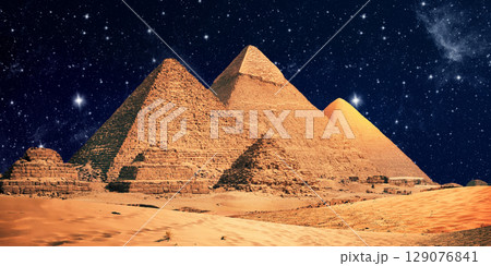night scene of the castle pyramid in the desert 129076841