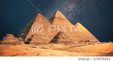 night scene of the castle pyramid in the desert 129076863