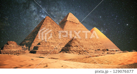 night scene of the castle pyramid in the desert 129076877