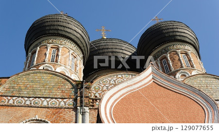 The domes of the Russian Orthodox Church stand against the sky. 129077655