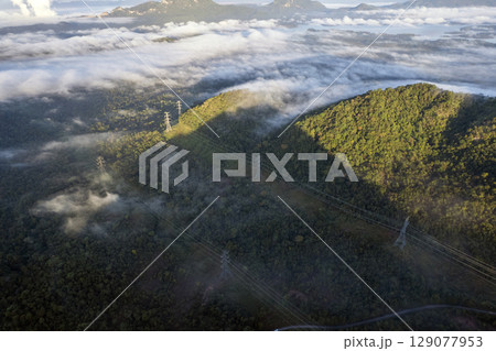 Landscape of Morning Mist with Mountain Layer. mountain ridge and clouds in rural jungle bush forest 129077953