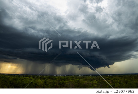 Storm clouds with the rain. Nature Environment Dark huge cloud sky black stormy cloud 129077962
