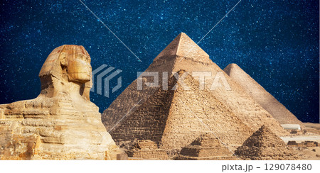 night scene of the castle pyramid in the desert 129078480